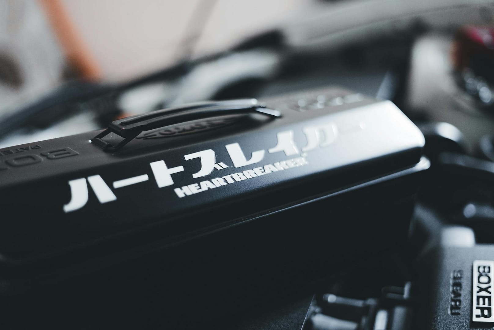 Detailed close-up of a car engine featuring the text 'Heartbreaker' for automotive enthusiasts.